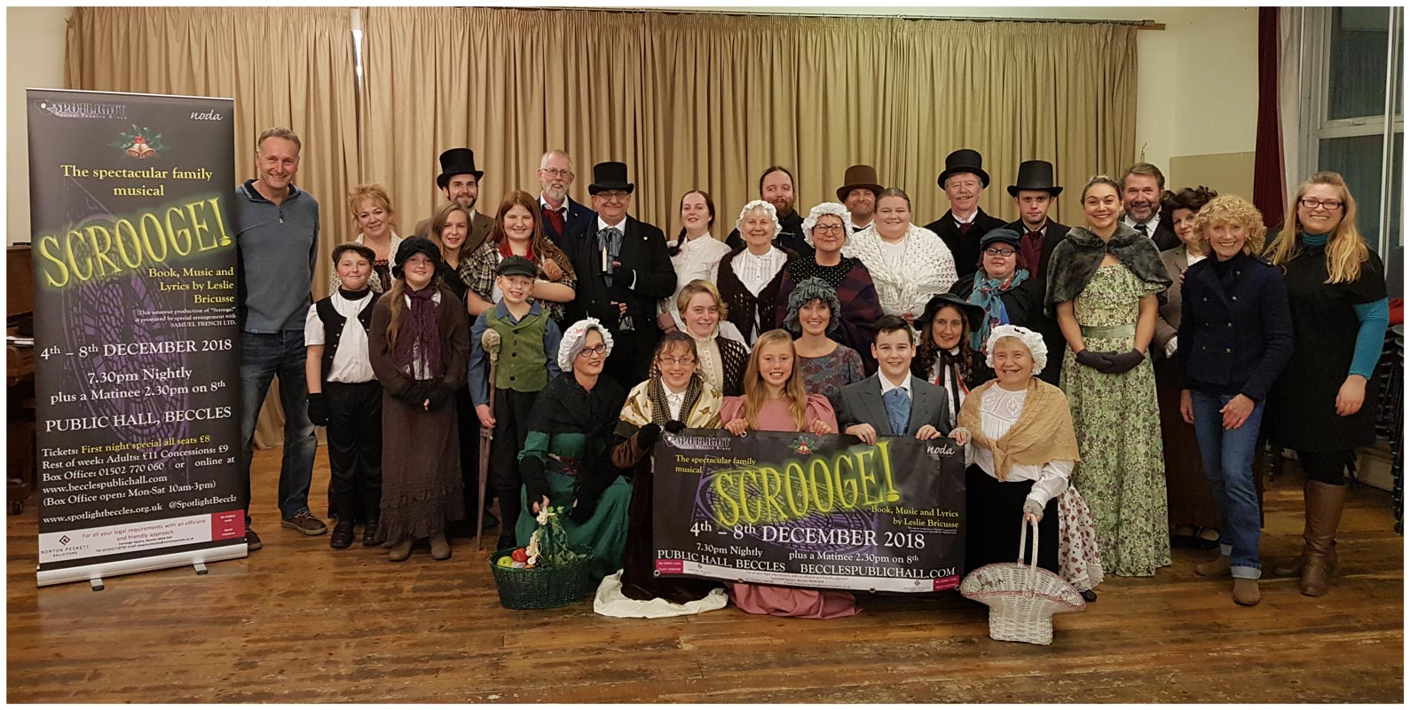 Norton Peskett Chief Executive Bob Bryant, left, with the production team and cast of Scrooge!